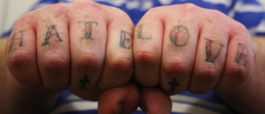 Hate and love tattooed on knuckles of St George's Crypt resident